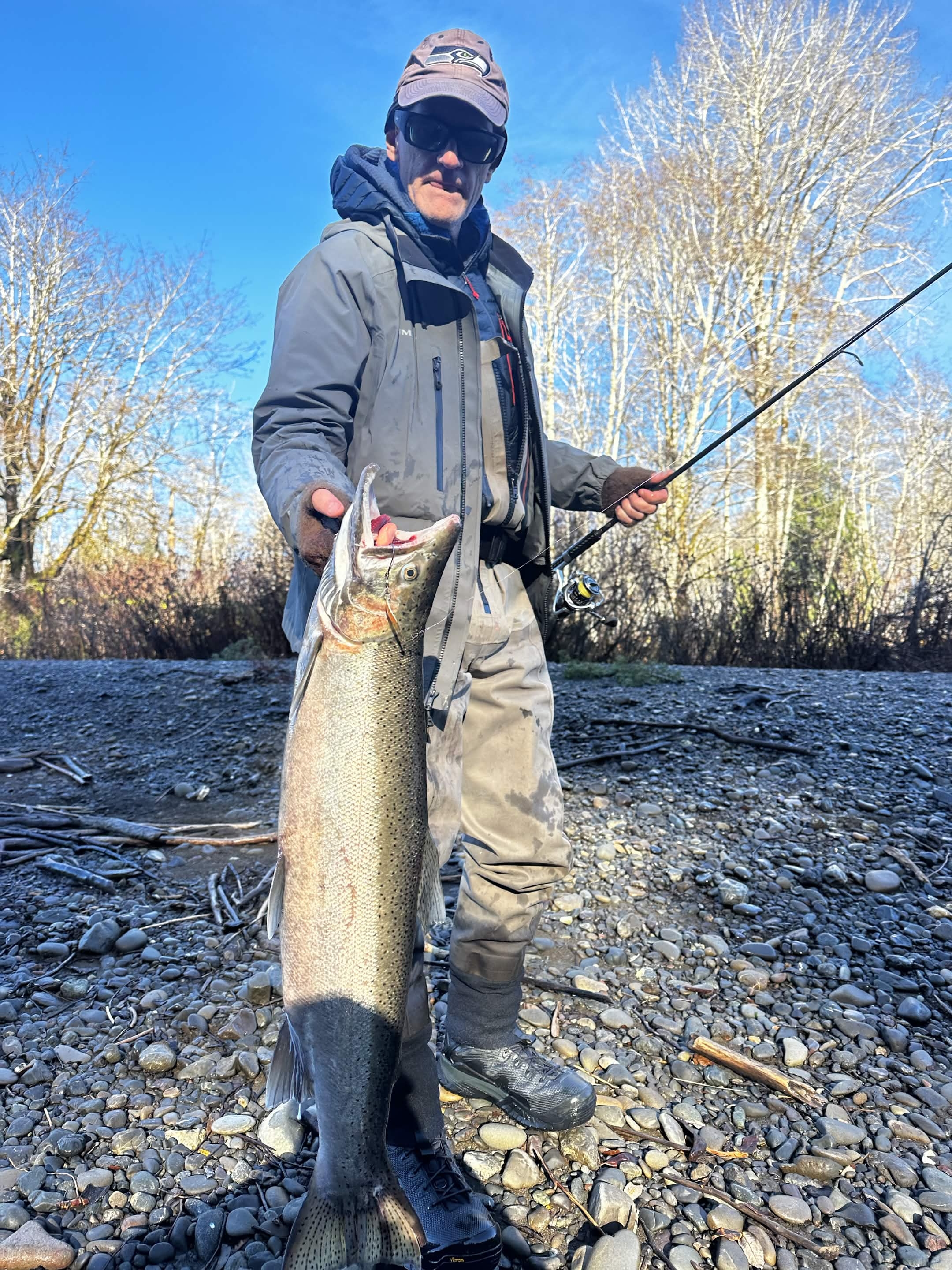 Angler holding a fish on a Washington river