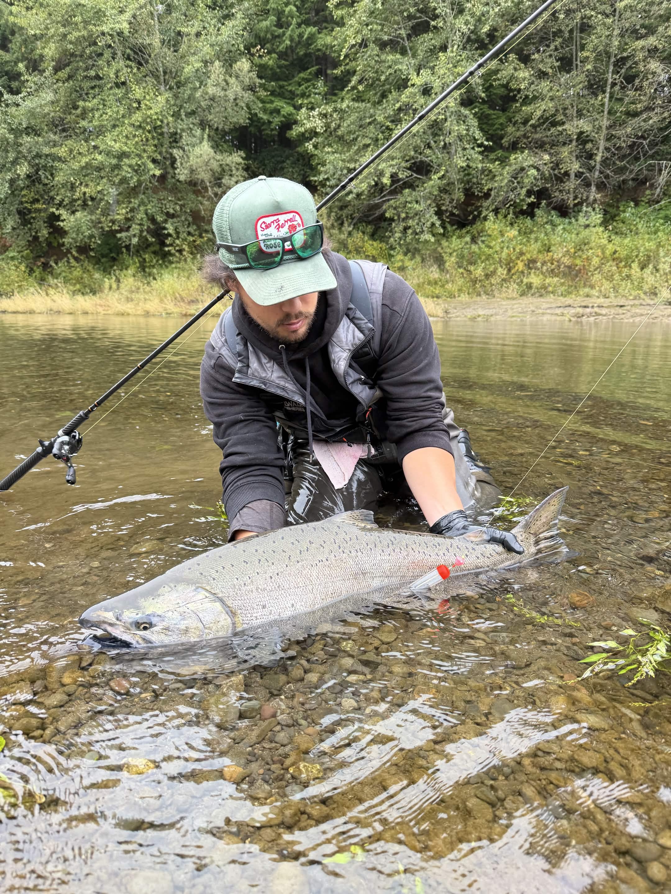 Angler holding a fish on a Washington river