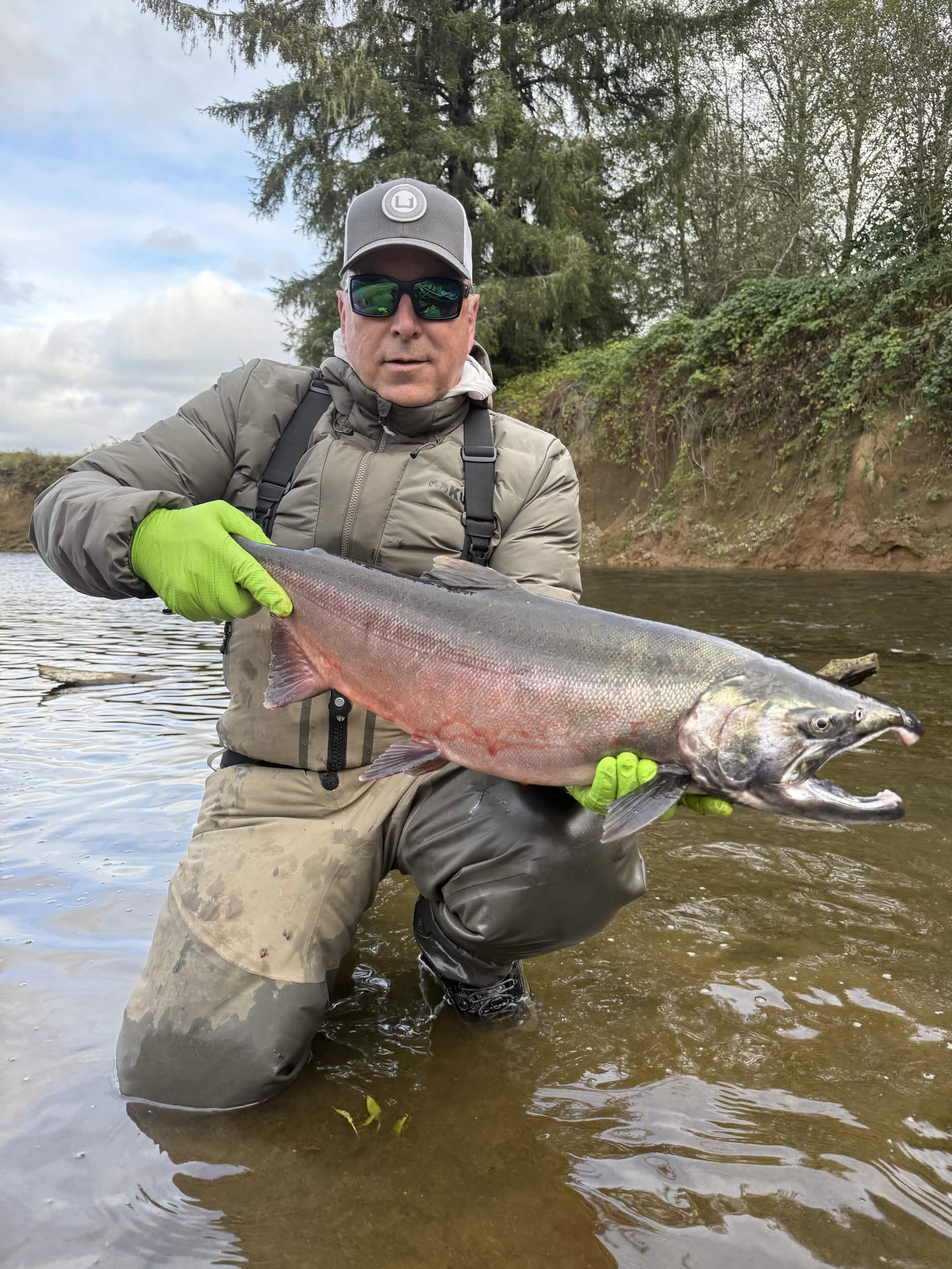Angler holding a fish on a Washington river