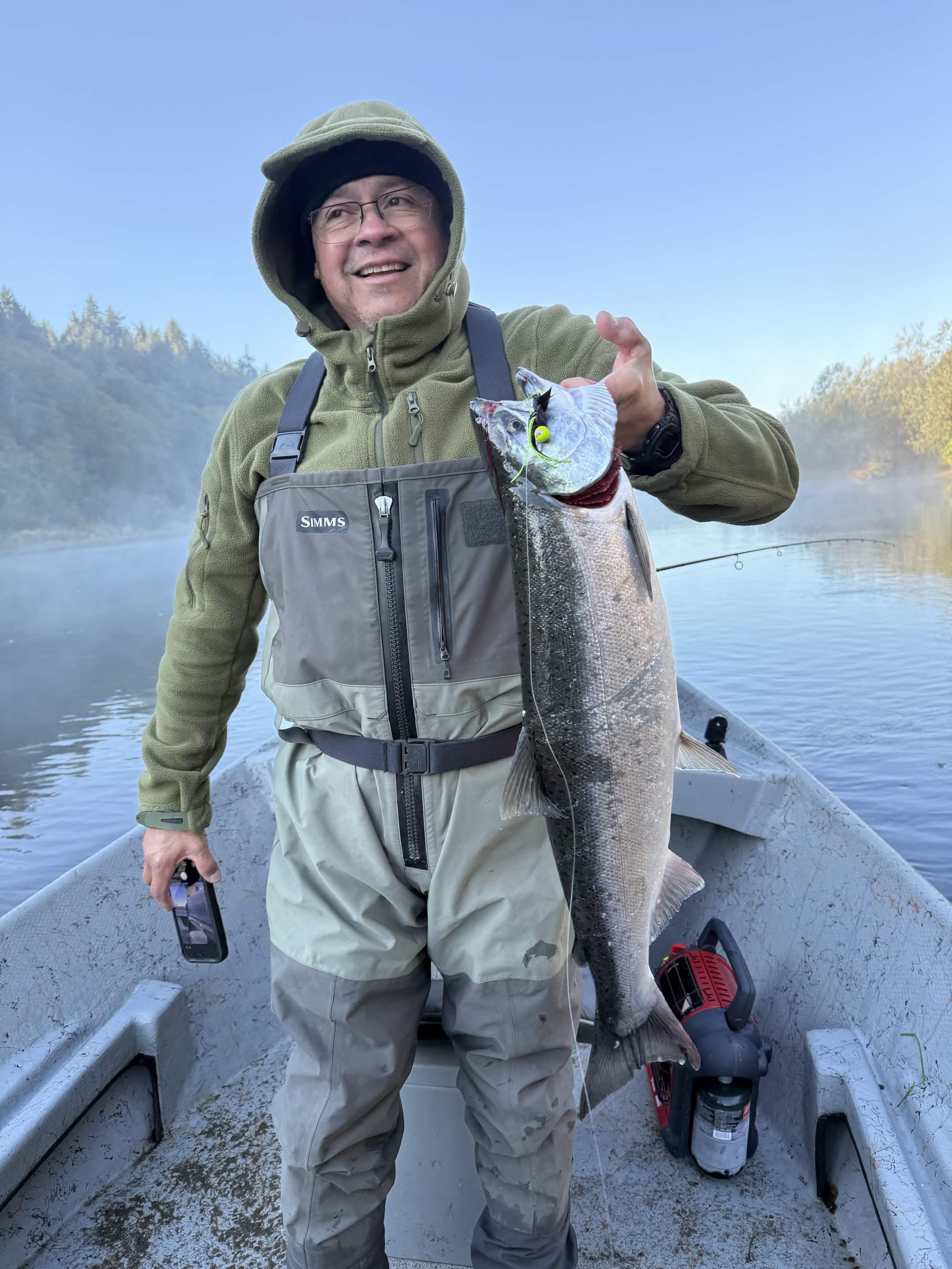 Angler holding a fish on a Washington river