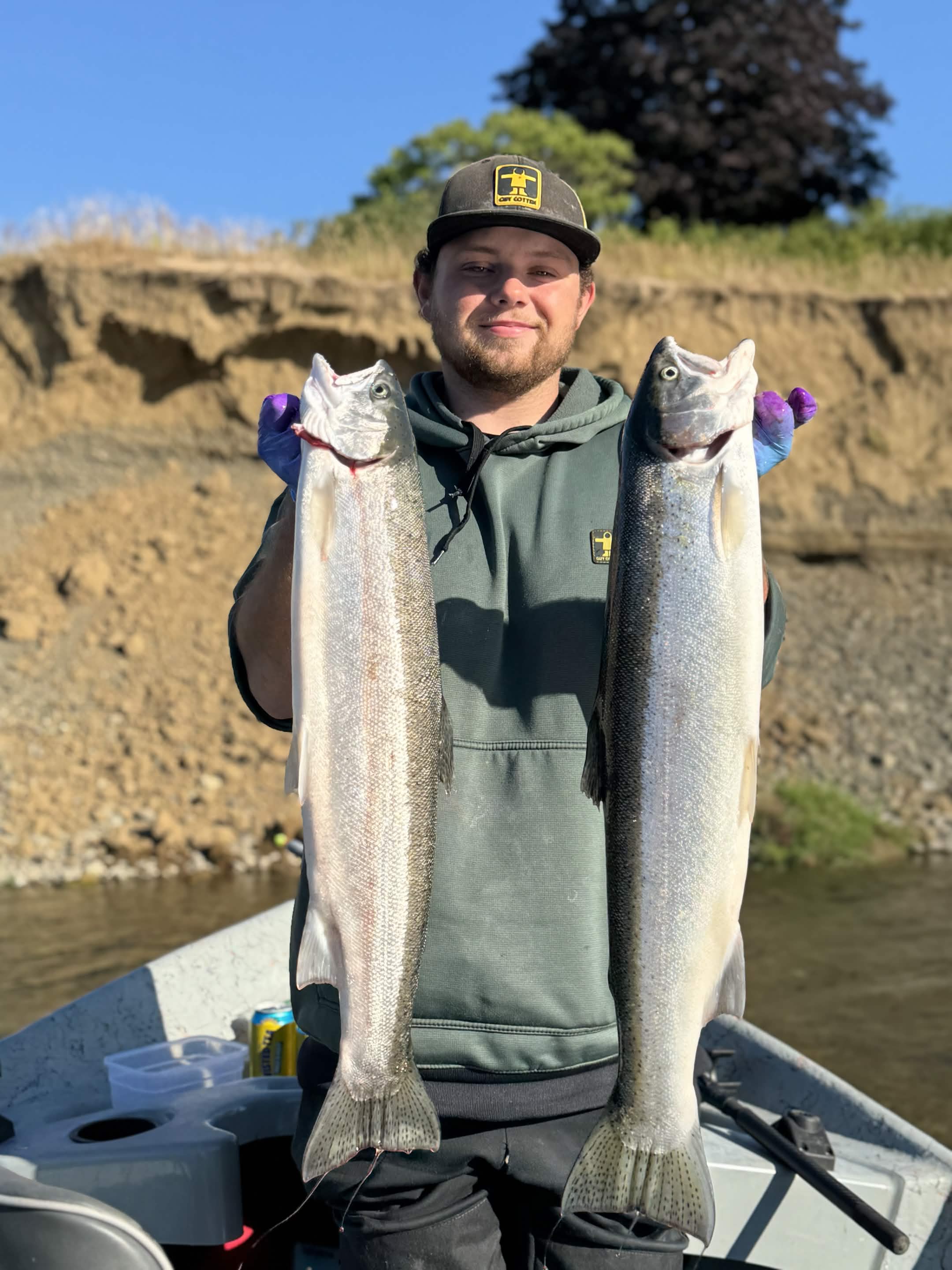 Angler holding a fish on a Washington river