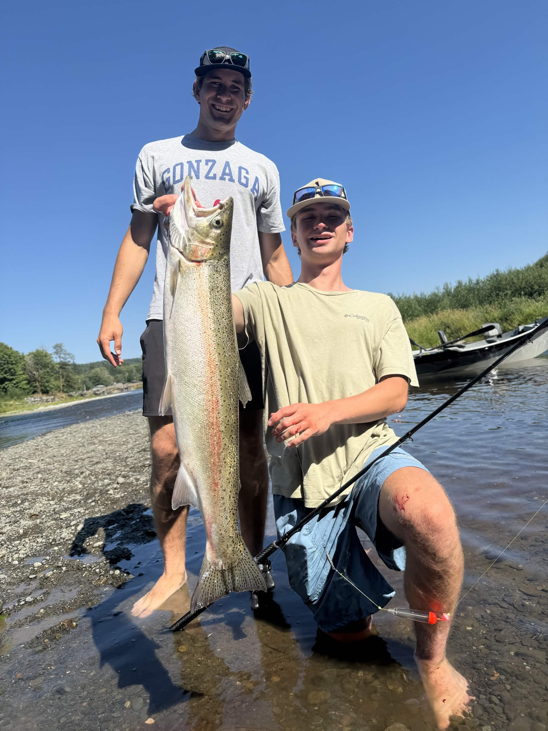 Angler holding a fish on a Washington river