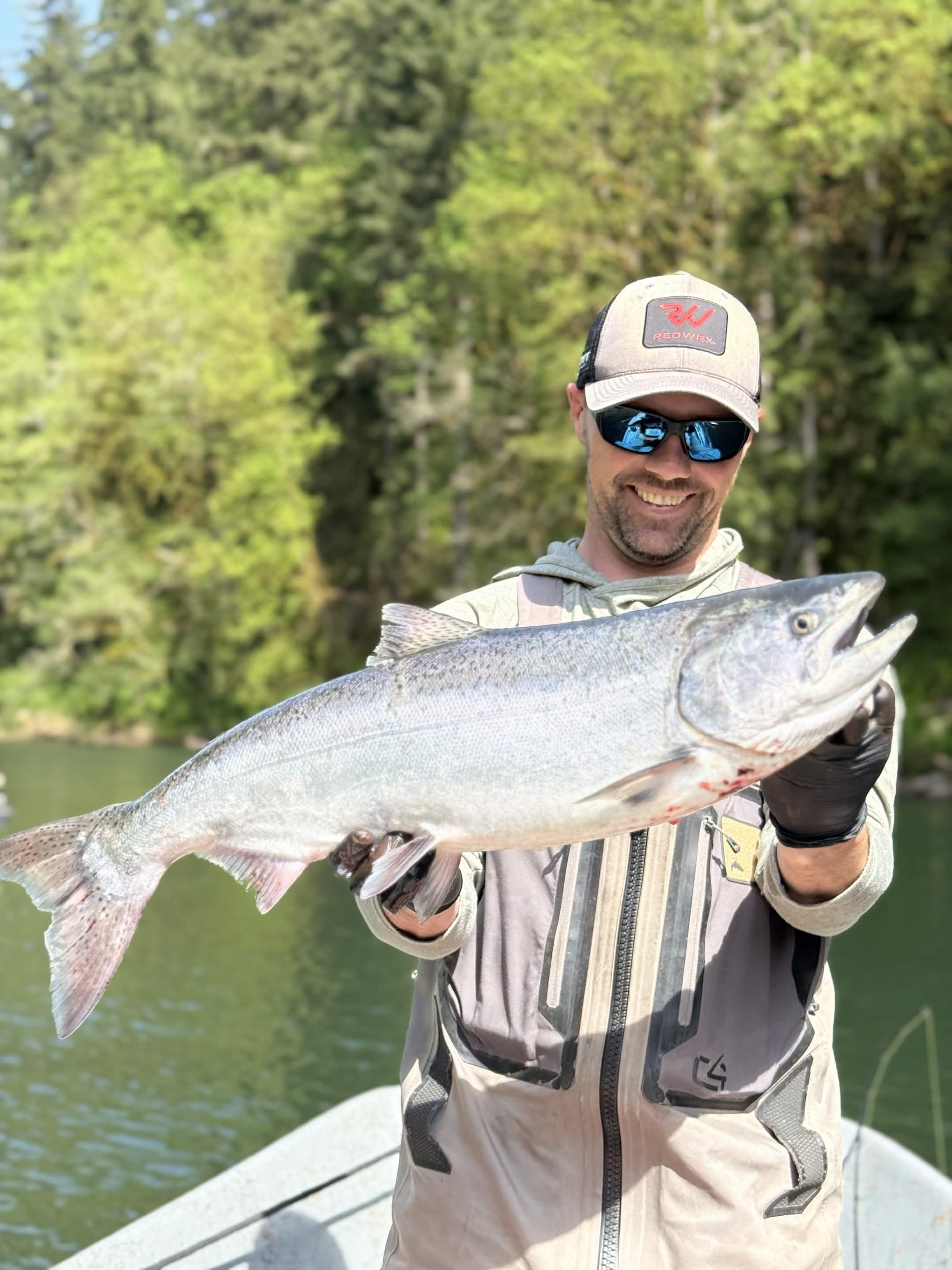 Angler holding a fish on a Washington river