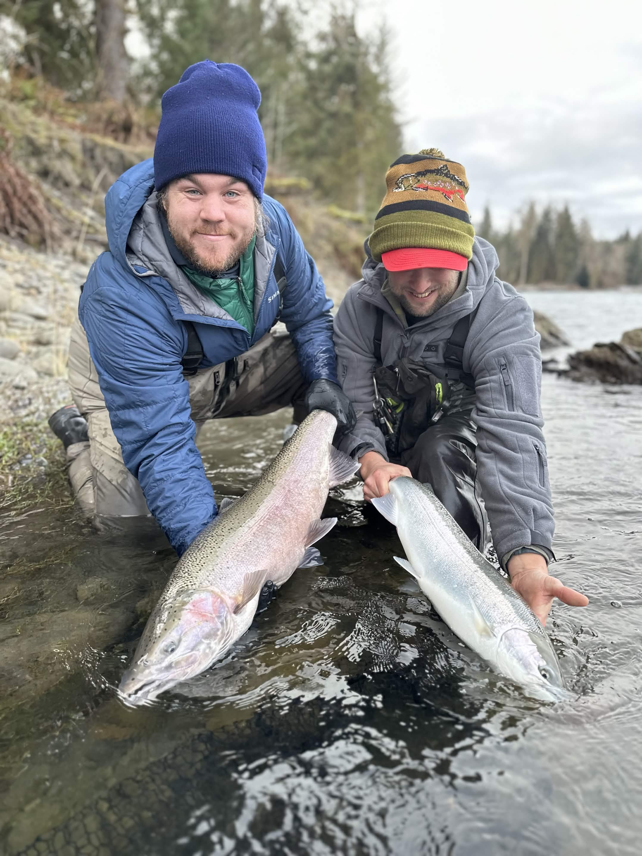 Angler holding a fish on a Washington river